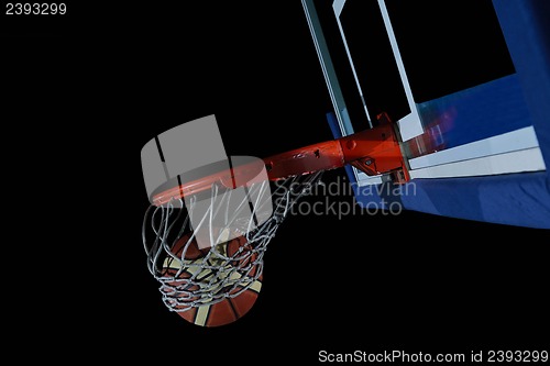 Image of basketball ball and net on black background