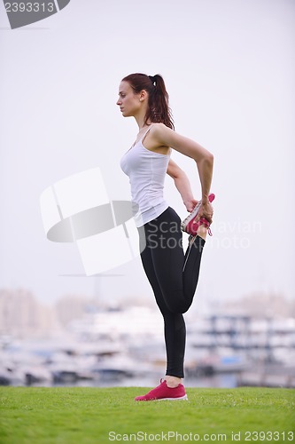 Image of Young beautiful  woman jogging  on morning