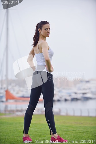 Image of Young beautiful  woman jogging  on morning