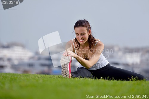 Image of Young beautiful  woman jogging  on morning