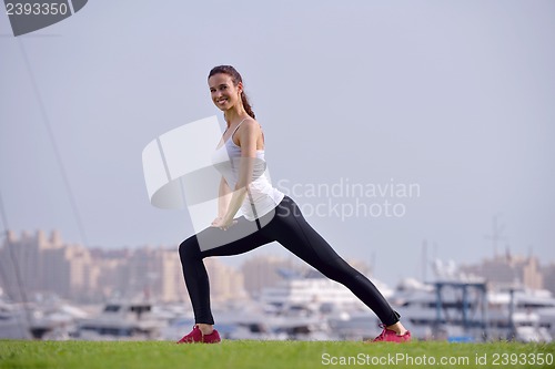 Image of Young beautiful  woman jogging  on morning