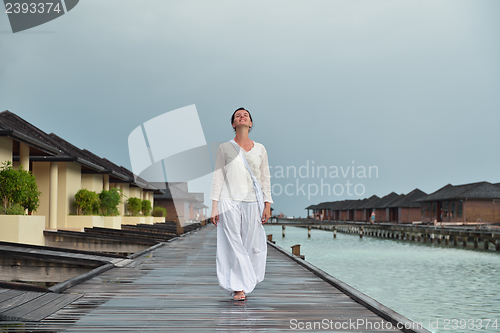 Image of young woman relax on cloudy summer day