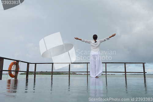 Image of young woman relax on cloudy summer day