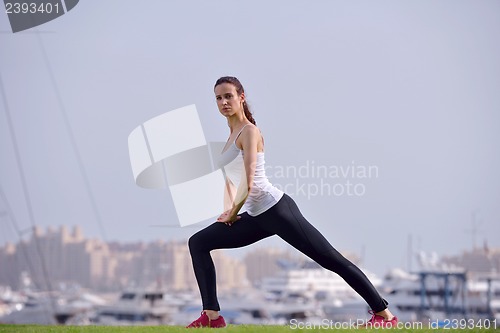 Image of Young beautiful  woman jogging  on morning