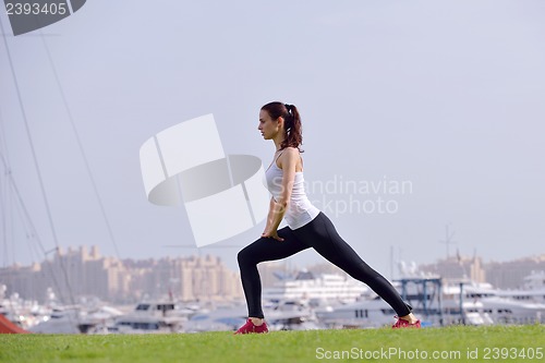 Image of Young beautiful  woman jogging  on morning