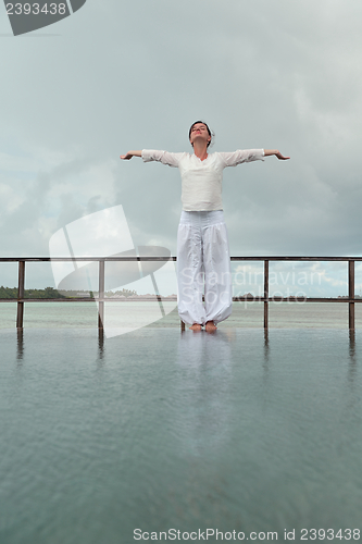 Image of young woman relax on cloudy summer day