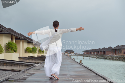 Image of young woman relax on cloudy summer day