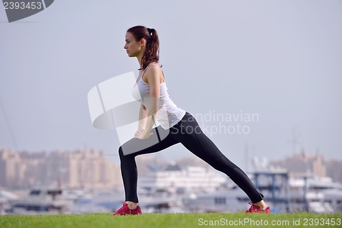 Image of Young beautiful  woman jogging  on morning