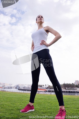Image of Young beautiful  woman jogging  on morning