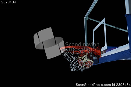 Image of basketball ball and net on black background