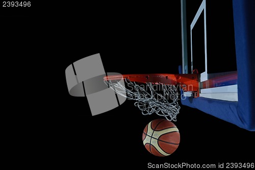 Image of basketball ball and net on black background