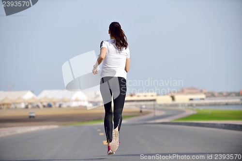 Image of woman jogging at morning