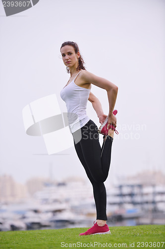 Image of Young beautiful  woman jogging  on morning