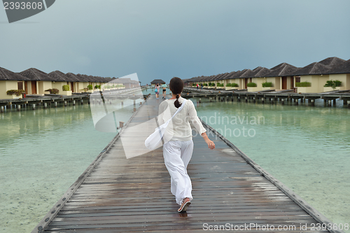Image of young woman relax on cloudy summer day
