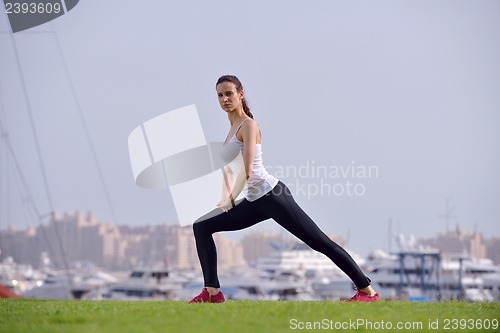 Image of Young beautiful  woman jogging  on morning