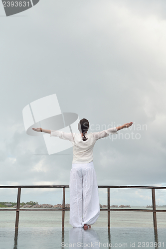 Image of young woman relax on cloudy summer day