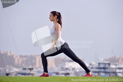 Image of Young beautiful  woman jogging  on morning