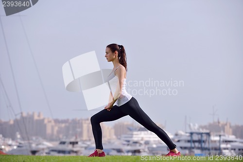 Image of Young beautiful  woman jogging  on morning