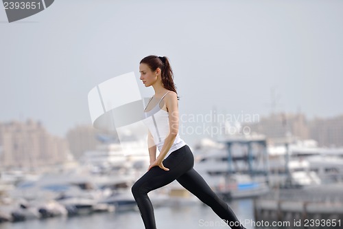 Image of Young beautiful  woman jogging  on morning
