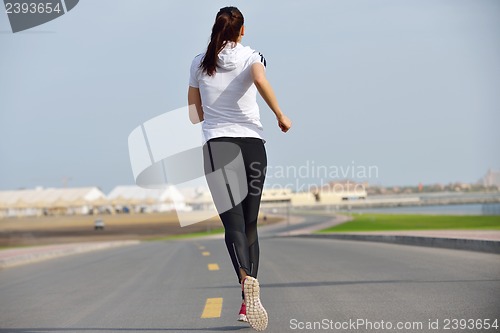 Image of woman jogging at morning