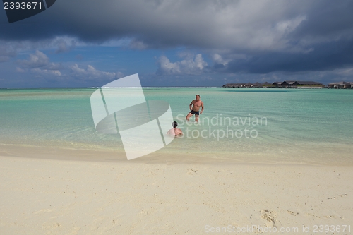 Image of happy young couple have fun on summer