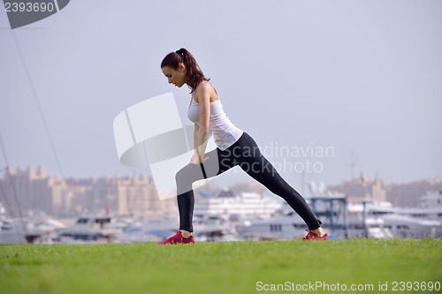 Image of Young beautiful  woman jogging  on morning