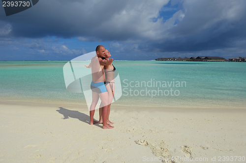 Image of happy young couple have fun on summer