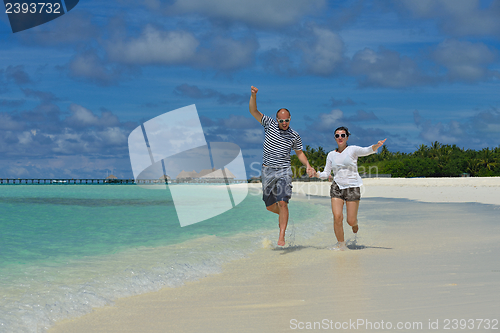Image of happy young couple have fun on summer