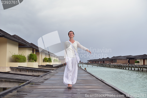 Image of young woman relax on cloudy summer day