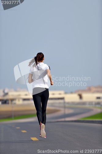 Image of woman jogging at morning