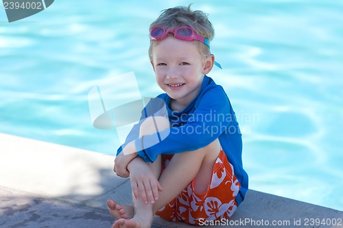 Image of kid by the swimming pool