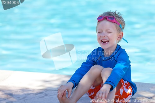 Image of kid by the swimming pool