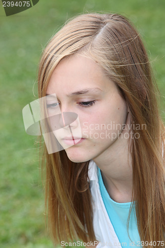 Image of Thoughtful sad teenage girl
