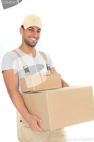 Image of Confident young man carrying cardboard boxes