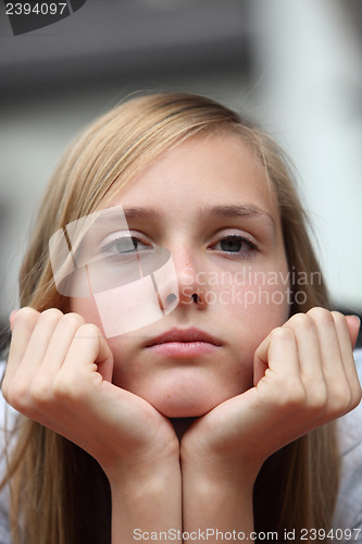 Image of Bored young girl staring at the camera