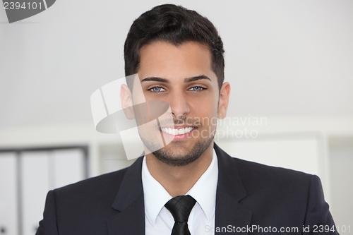 Image of Smiling friendly businessman