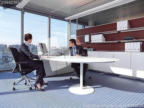 Image of Business couple working at office a