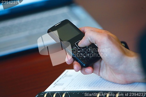 Image of hand and mobile phone