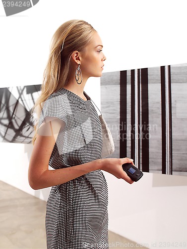 Image of women with mobile phones at exhibition 