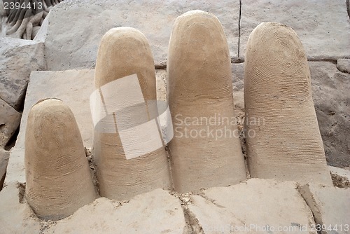 Image of Fingers out of the sand.