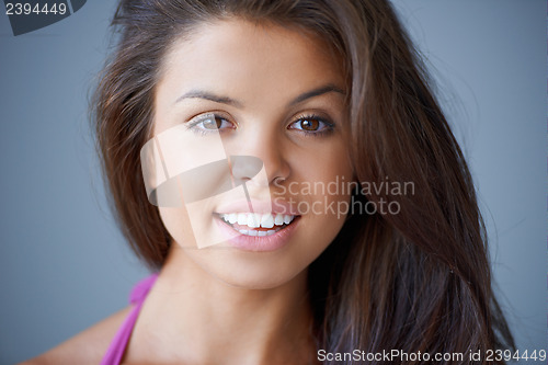 Image of Beautiful young woman smiling