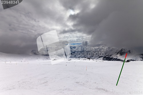 Image of Slope for slalom and sky with storm clouds