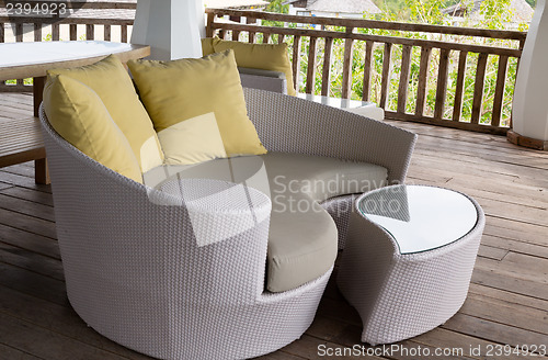 Image of wicker sofa with pillow