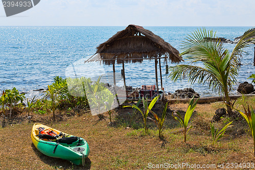 Image of Plastic kayak on the shore next to the hut