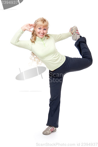 Image of Young girl doing stretching exercises for the legs. Isolate on w