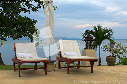 Image of two sunbeds on a cloudy day