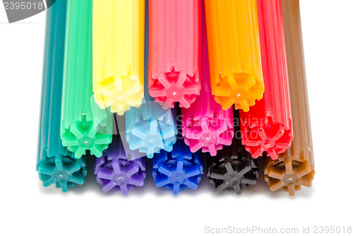 Image of various color felt tip pens stacked on white 