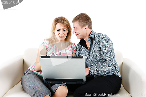 Image of Young woman and a man with a laptop