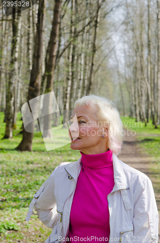 Image of Portrait of a middle-aged woman in a spring Park  