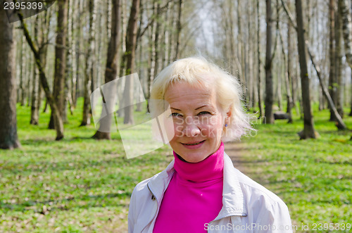 Image of Portrait of a middle-aged woman in a spring Park  